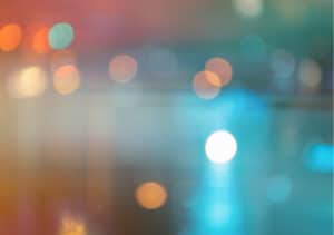 Bright teal and white bokeh with warm amber accents